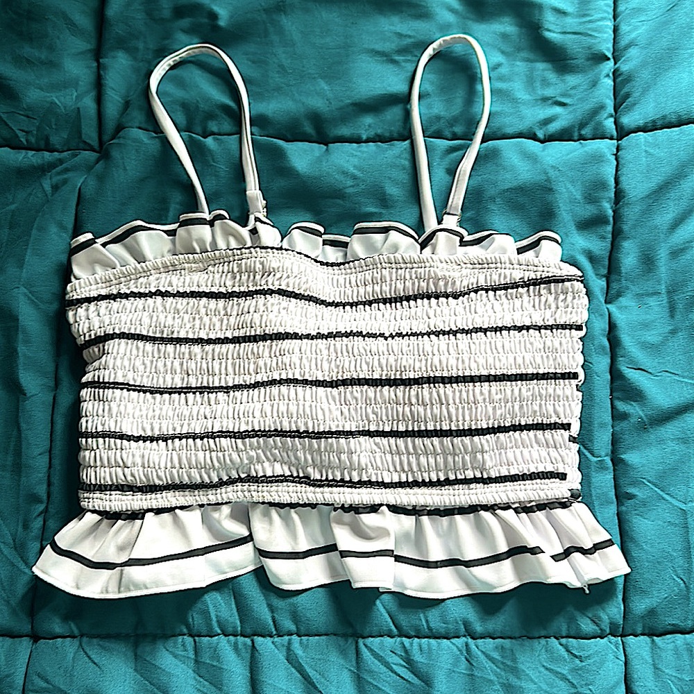 white ruffled bathing suit top with black stripes